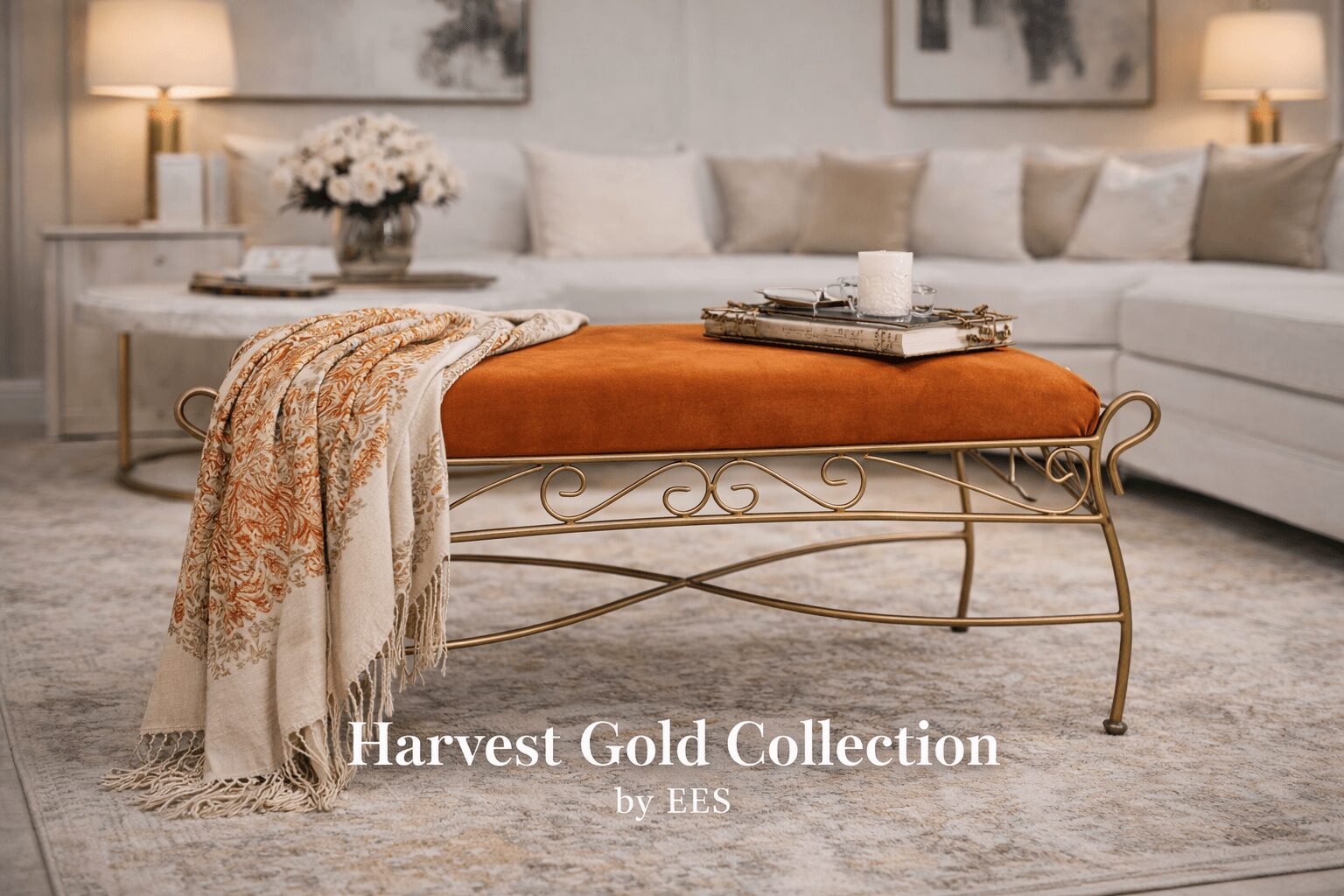 Living room with beige sofa, orange velvet bench, and decorative items on table and walls.