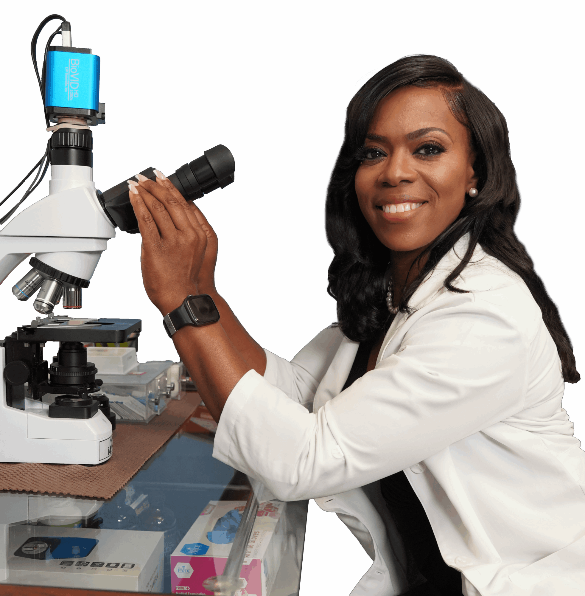 Woman scientist in white coat using a microscope in a laboratory setting.