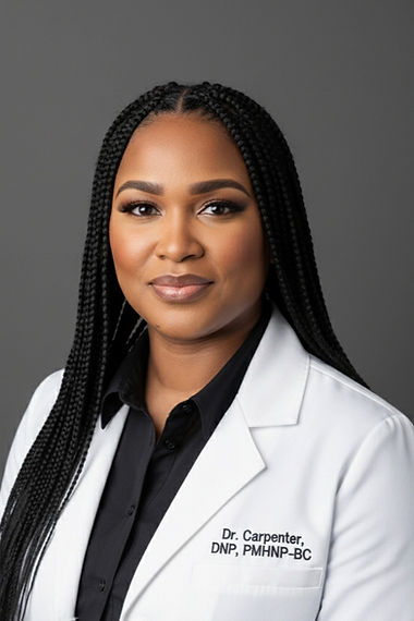 Professional woman with braided hair wearing a white lab coat and black shirt, smiling at the camera.