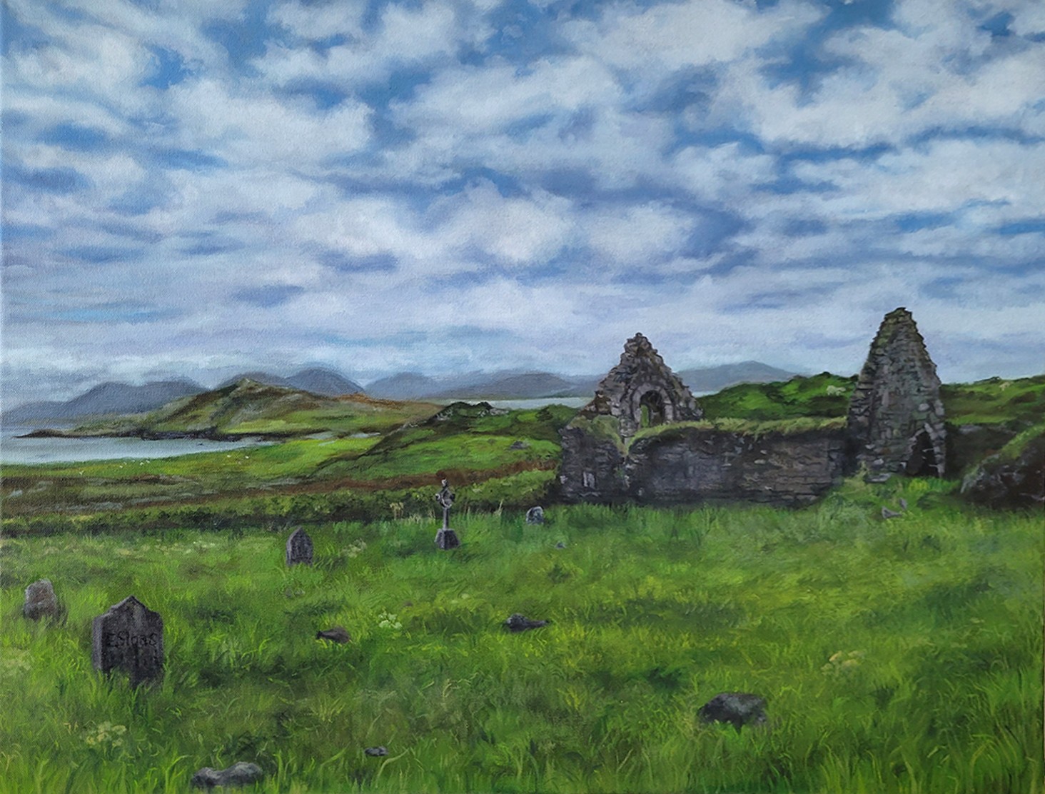 Landscape with green fields, ruins, hills, and a partly cloudy sky.