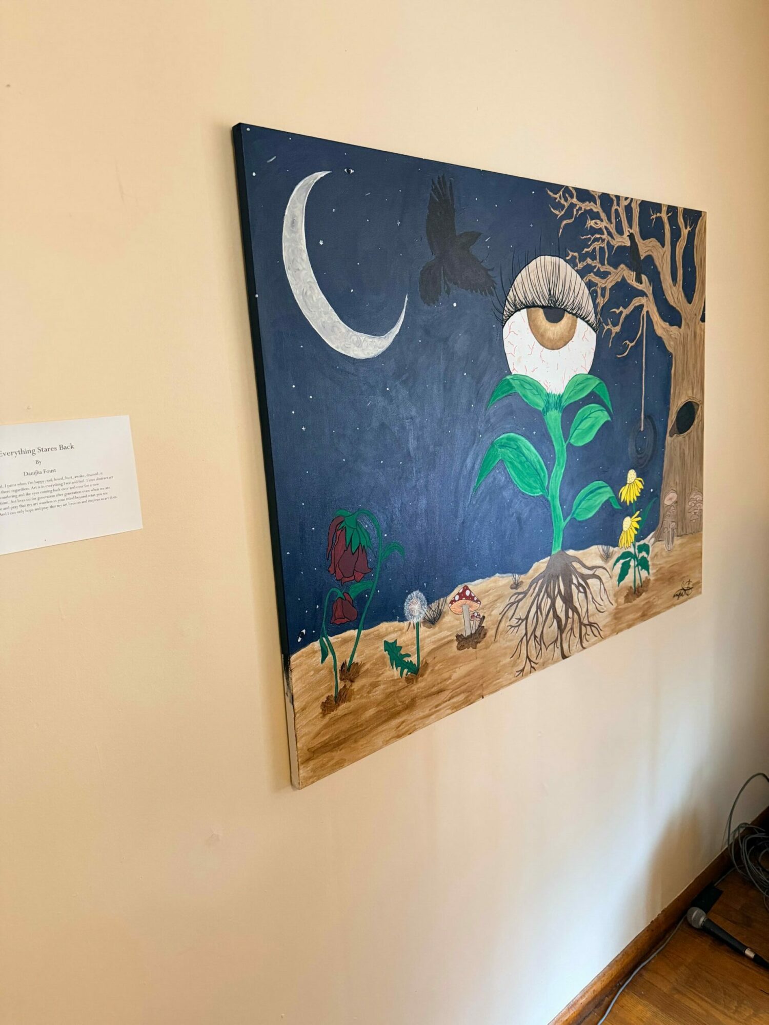 Painting depicts a night scene with a crescent moon, a large green frog, and a landscape with trees and a river.