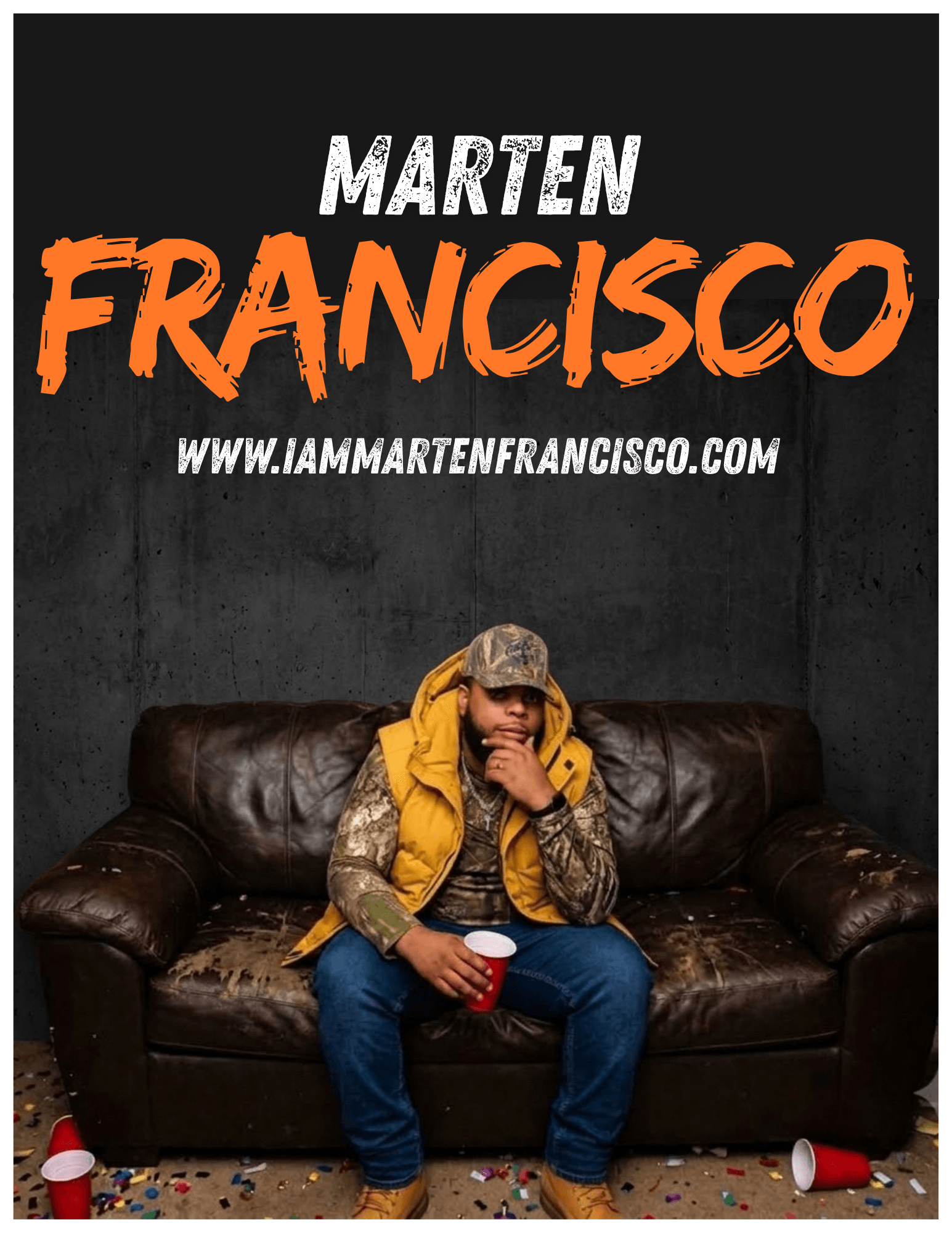 Person wearing a yellow vest sits on a dark leather couch beneath large white and orange lettering.